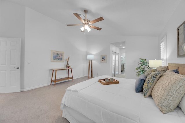 carpeted bedroom with ceiling fan, connected bathroom, and vaulted ceiling