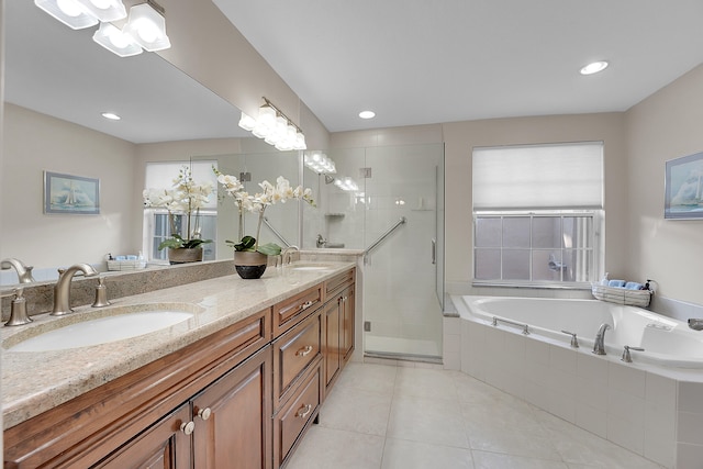 bathroom featuring vanity, separate shower and tub, and tile patterned floors