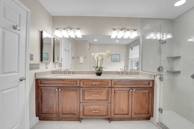 bathroom featuring vanity, tile patterned flooring, and a shower with shower door