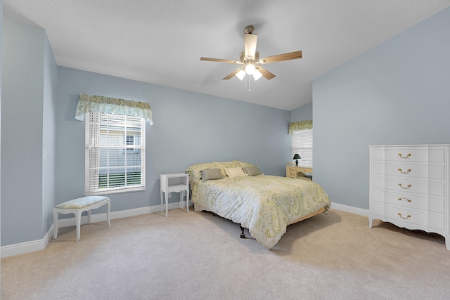 carpeted bedroom with lofted ceiling and ceiling fan