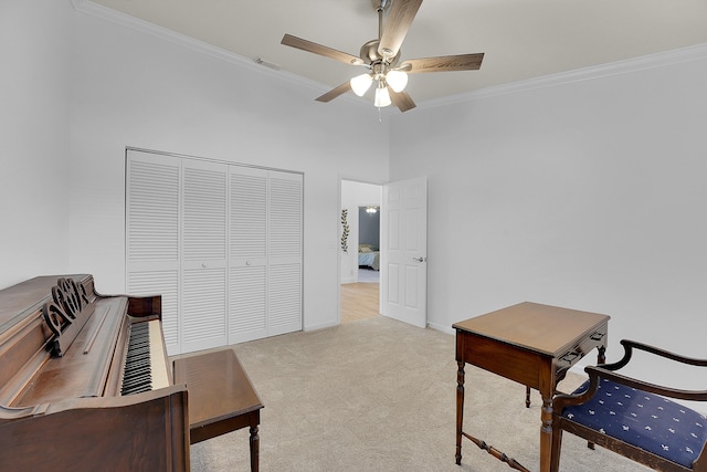 carpeted home office with ornamental molding and ceiling fan