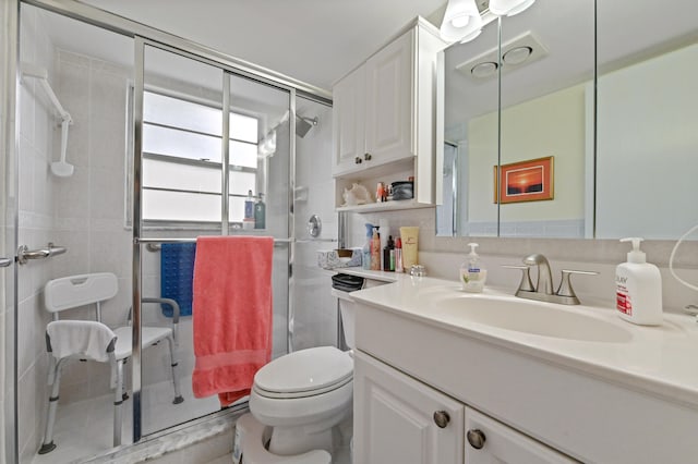 bathroom featuring tile walls, an enclosed shower, vanity, and toilet