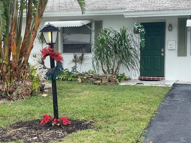 entrance to property with a yard