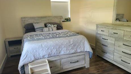 bedroom featuring dark wood-type flooring