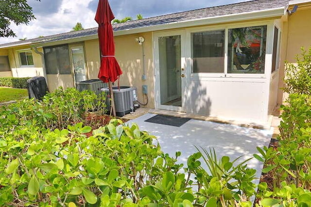 exterior space with a patio area and central air condition unit