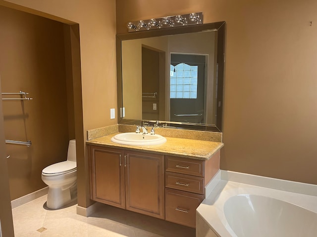 bathroom with toilet, vanity, a washtub, and tile patterned flooring