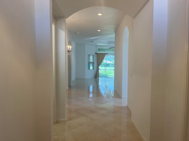 hall featuring light tile patterned floors