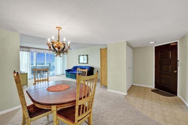 dining room with a notable chandelier