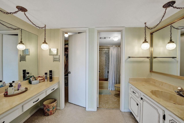 full bathroom with tile patterned flooring, shower / bath combo, vanity, and toilet