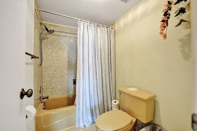 bathroom with shower / tub combo and toilet