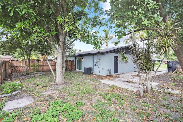 view of yard with a patio and central air condition unit