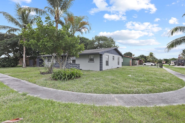 view of home's exterior featuring a yard