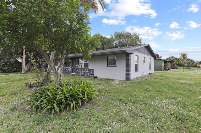 exterior space with a front yard