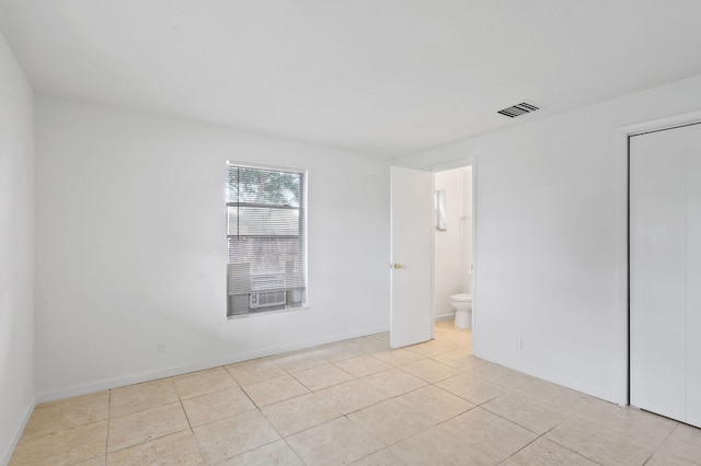 spare room featuring light tile patterned flooring