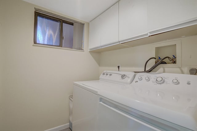 laundry room with cabinets and independent washer and dryer