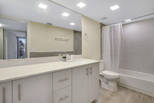 full bathroom featuring shower / bath combination with curtain, vanity, toilet, and hardwood / wood-style flooring