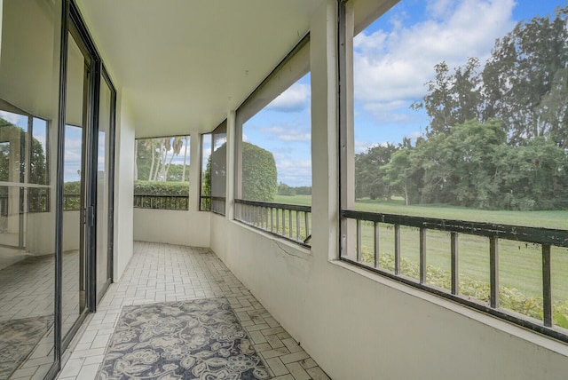 unfurnished sunroom with plenty of natural light