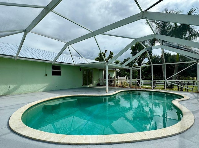 view of pool featuring a lanai and a patio area