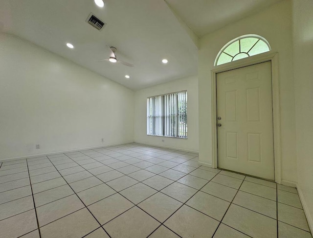 foyer with ceiling fan, light tile patterned floors, and a healthy amount of sunlight