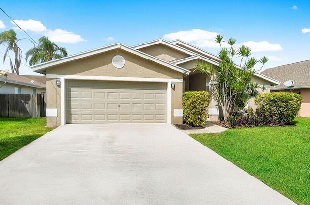 view of front facade featuring a front lawn and a garage