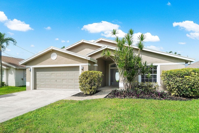 view of front of home featuring a garage and a front lawn