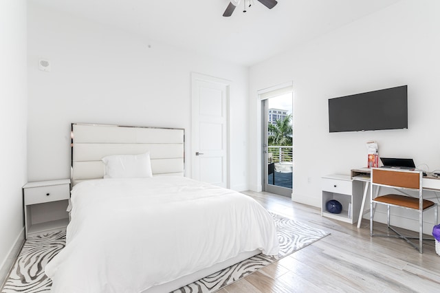 bedroom with light hardwood / wood-style flooring, ceiling fan, and access to exterior