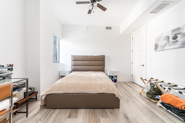 bedroom featuring light hardwood / wood-style flooring and ceiling fan