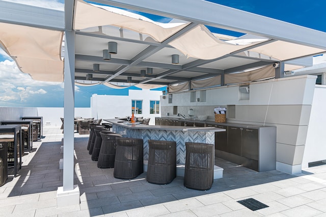 view of patio / terrace with an outdoor bar