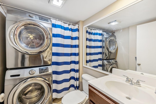 washroom featuring stacked washer / dryer and sink