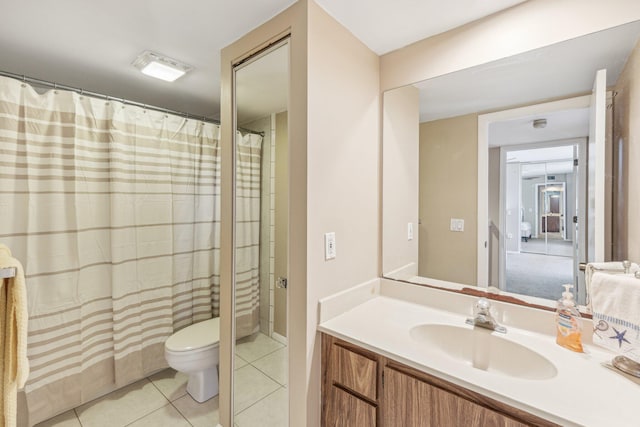 bathroom featuring tile patterned flooring, vanity, toilet, and a shower with shower curtain