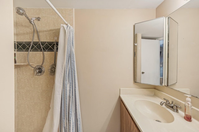 bathroom featuring vanity and a shower with shower curtain