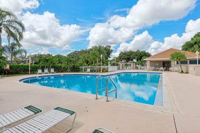 view of swimming pool with a patio area