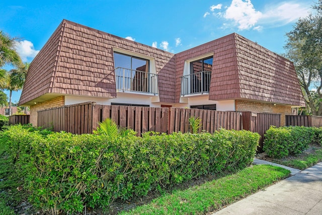 view of home's exterior featuring a balcony