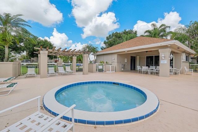 view of pool with a patio and a pergola