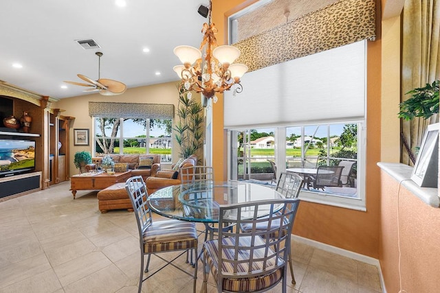 dining space featuring plenty of natural light, ceiling fan with notable chandelier, and light tile patterned floors