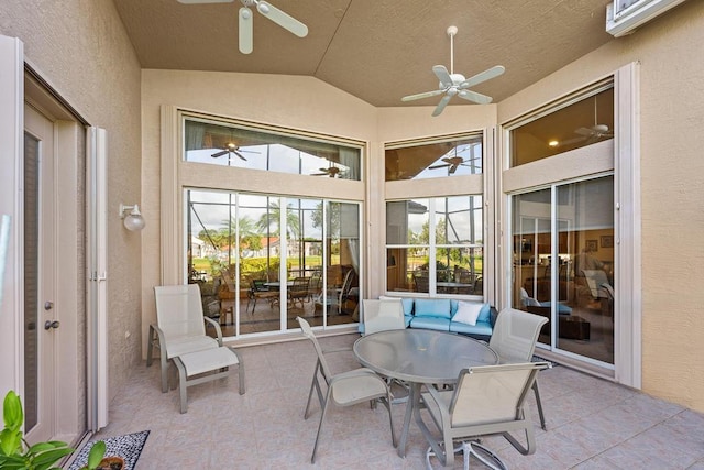 sunroom featuring lofted ceiling