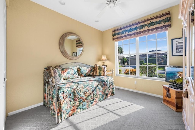 bedroom with ceiling fan and light colored carpet