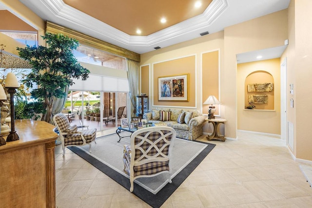 living room with a raised ceiling and a towering ceiling