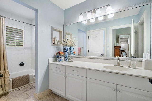 full bathroom featuring shower / tub combo with curtain, vanity, and toilet