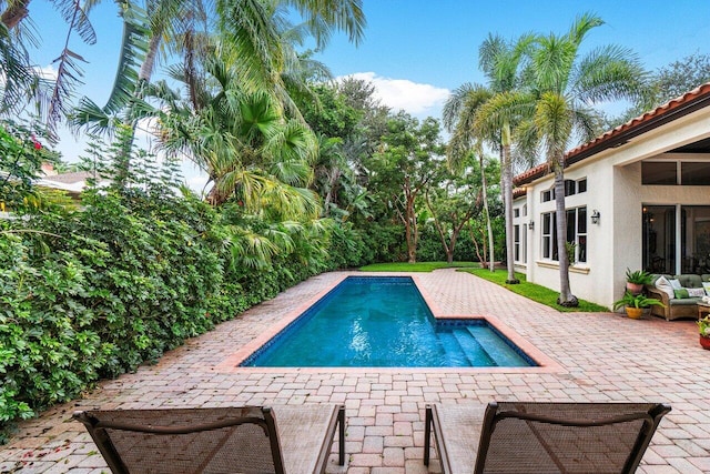 view of swimming pool featuring a patio