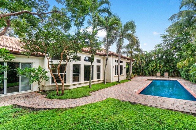 414 NW 13th St, Delray Beach, FL 33444 - swimming pool featuring a patio area and a lawn
