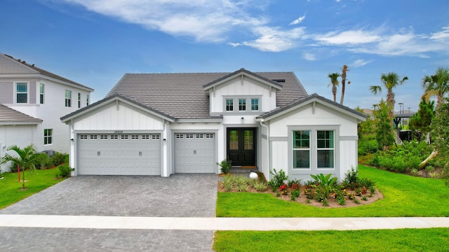 view of front facade with a garage and a front yard