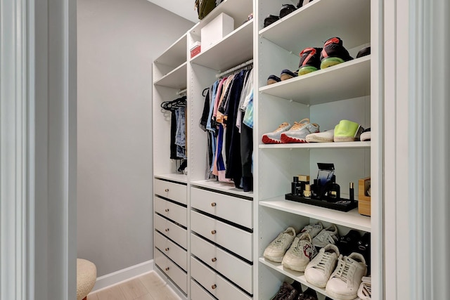 walk in closet featuring light hardwood / wood-style floors