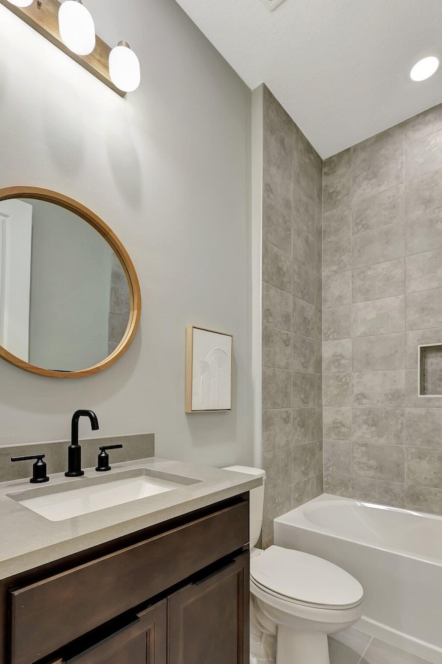 full bathroom with vanity, shower / bath combination, and toilet