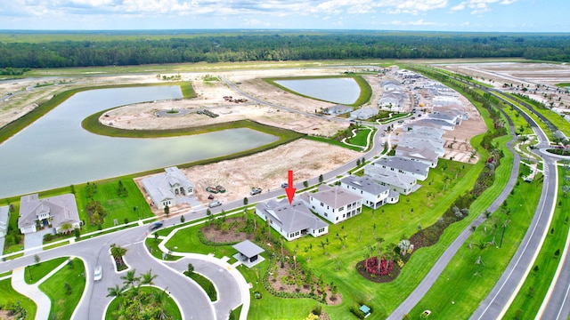 birds eye view of property featuring a water view