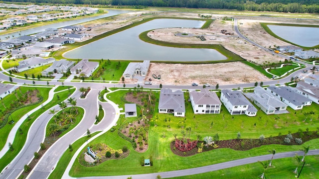 bird's eye view with a water view