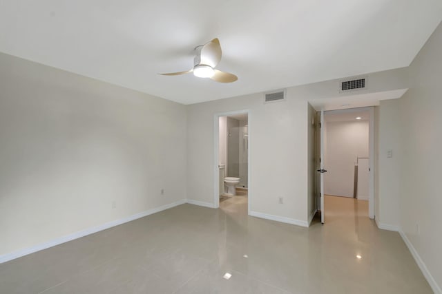 unfurnished bedroom featuring light tile patterned floors, ensuite bath, and ceiling fan