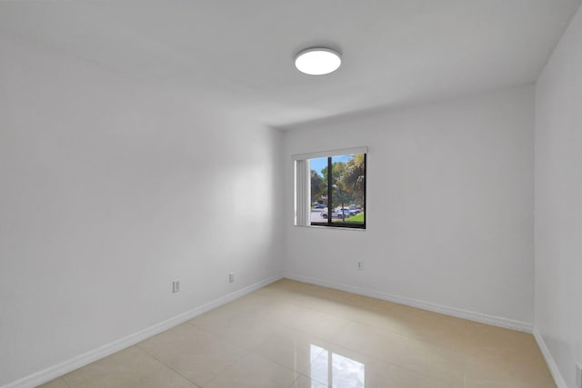 spare room with light tile patterned floors