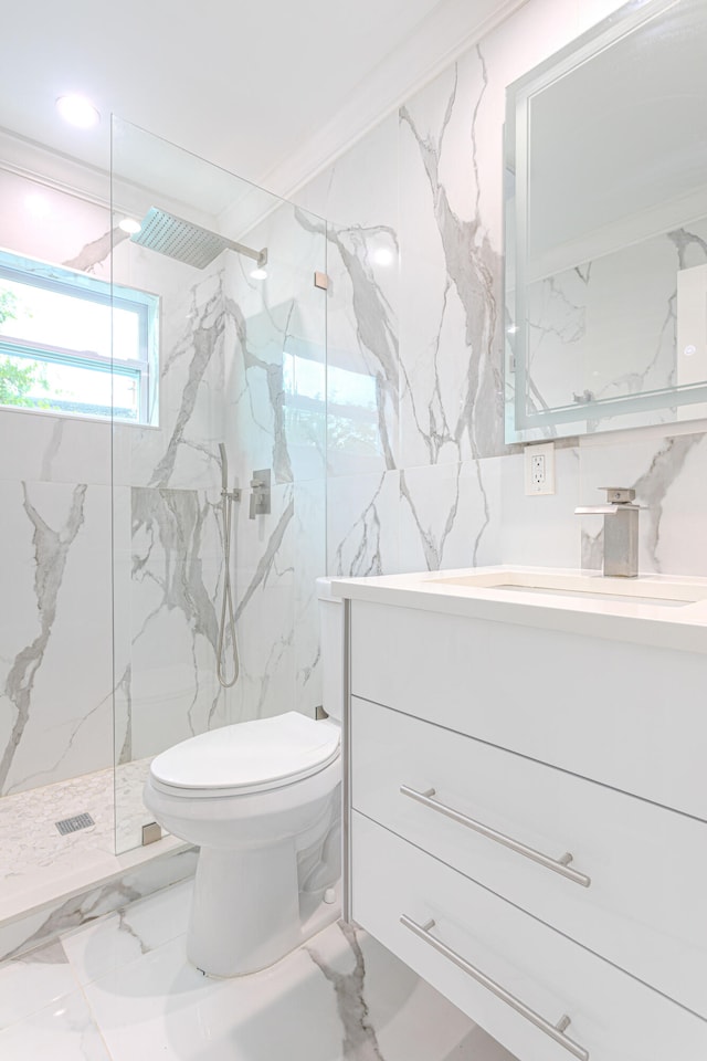 bathroom featuring ornamental molding, vanity, toilet, and tiled shower