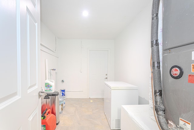 laundry room featuring heating unit